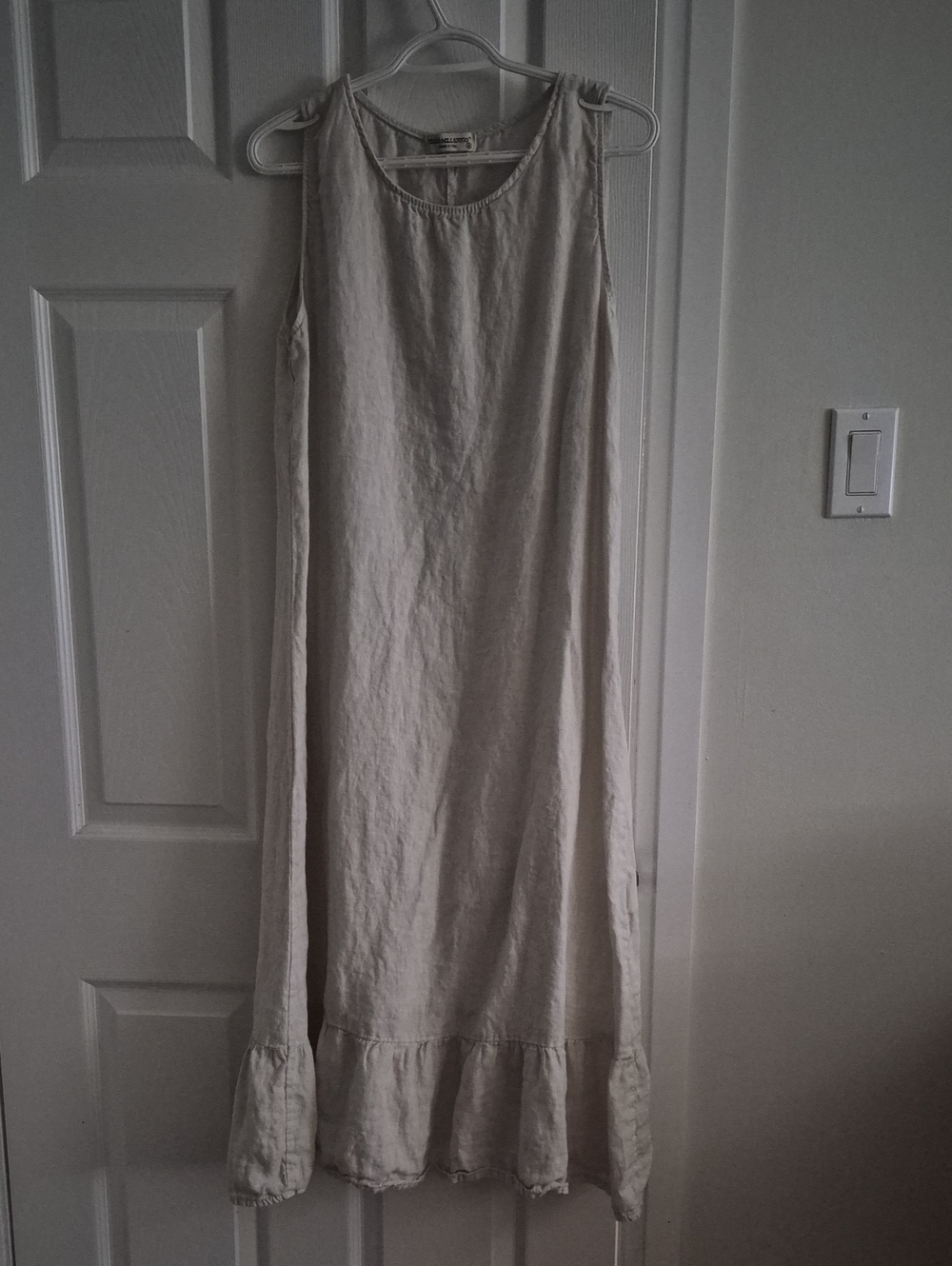 Sleeveless Cream Line Dress with Ruffle Hem
